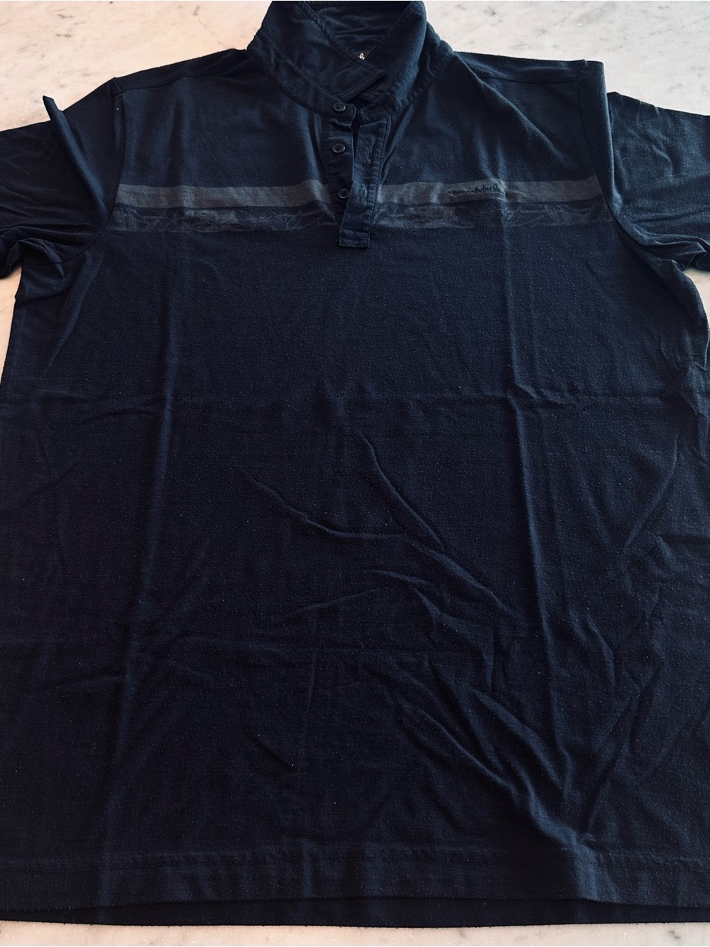Travis Mathew Black Polo with Subtle Chest Stripe